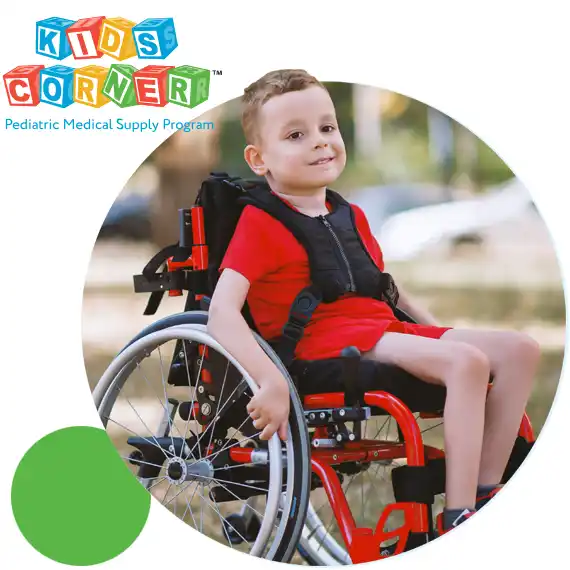 Boy in wheelchair wearing a red shirt