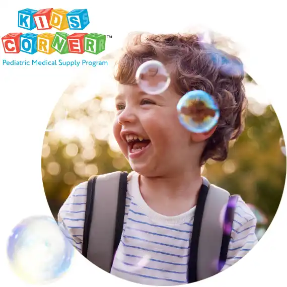 Child with feeding pump backpack on